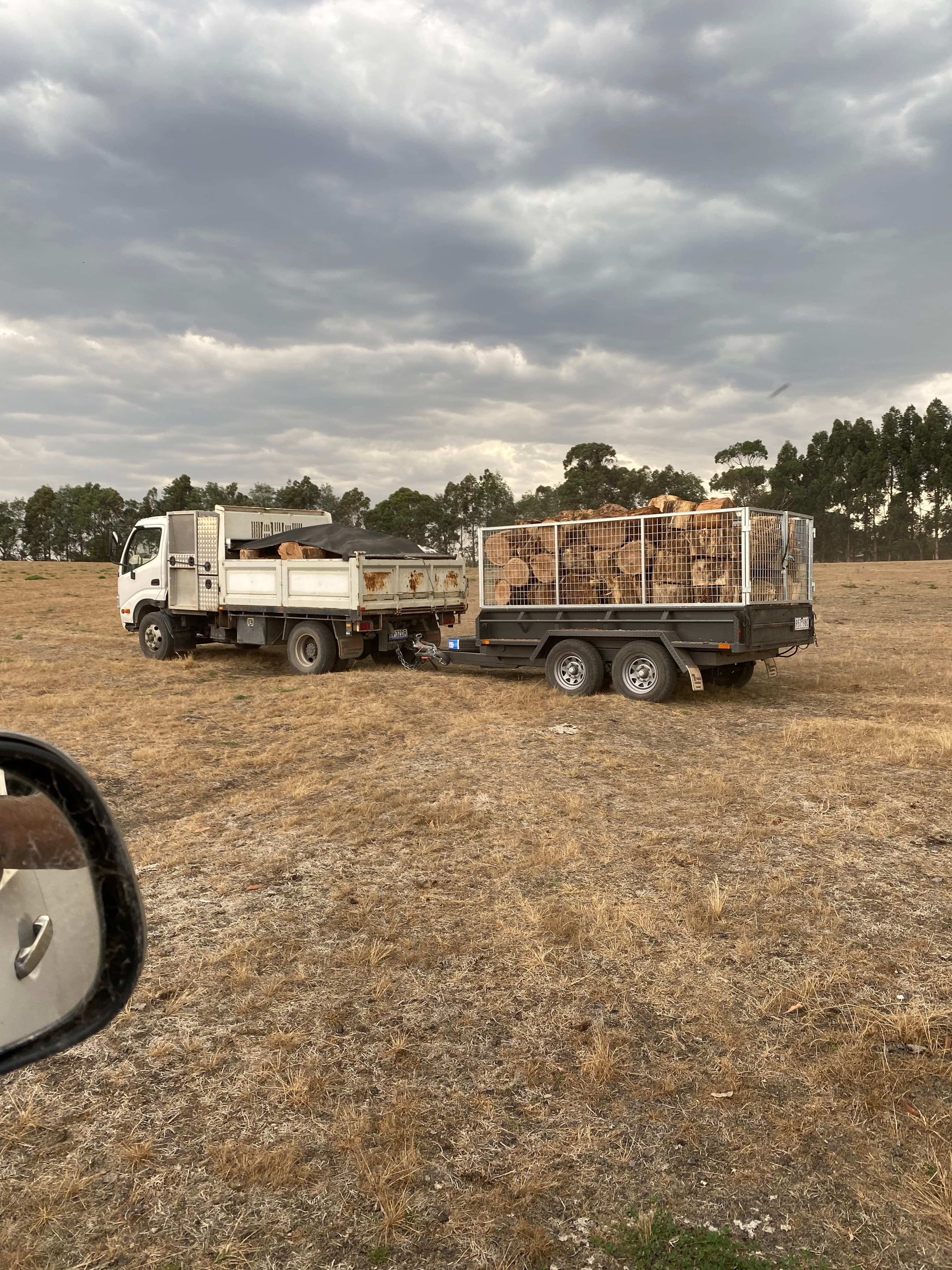Tipper truck and trailer loaded with firewood for Gippsland delivery